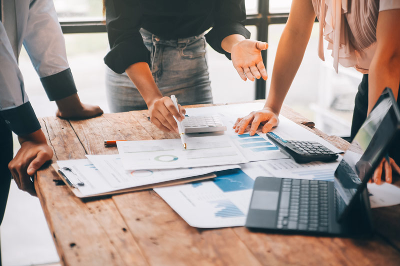 employees reviewing their sales process